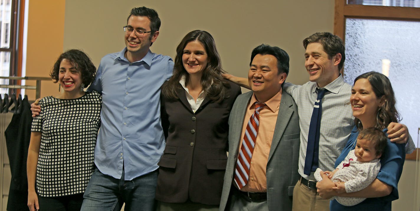 Six of the seven new Minneapolis council members, including from left, Alondra Cano, Andrew Johnson, Linea Palmisano, Blong Yang, Jacob Frey and Lisa Bender with 2-month-old baby Isabel Bender, took a break from training sessions for a group photo Wednesday, December 18, 2013 in downtown Minneapolis, MN. (ELIZABETH FLORES/STAR TRIBUNE) ELIZABETH FLORES &#x2022; eflores@startribune.com