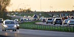 This photo shows traffic along Hwy. 10 just south of Main St. in Coon Rapids, MN. Between the traffic lanes one can see the cable median fence. ... as