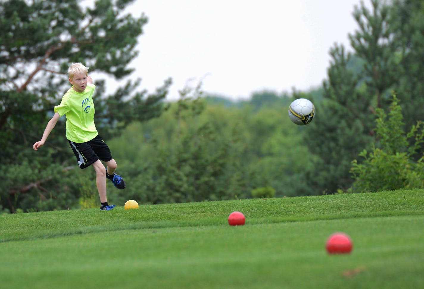 Anders Otness, 11, of Rosemount, teed off in a game of footgolf at Inver Wood Golf Course in Inver Grove Heights.