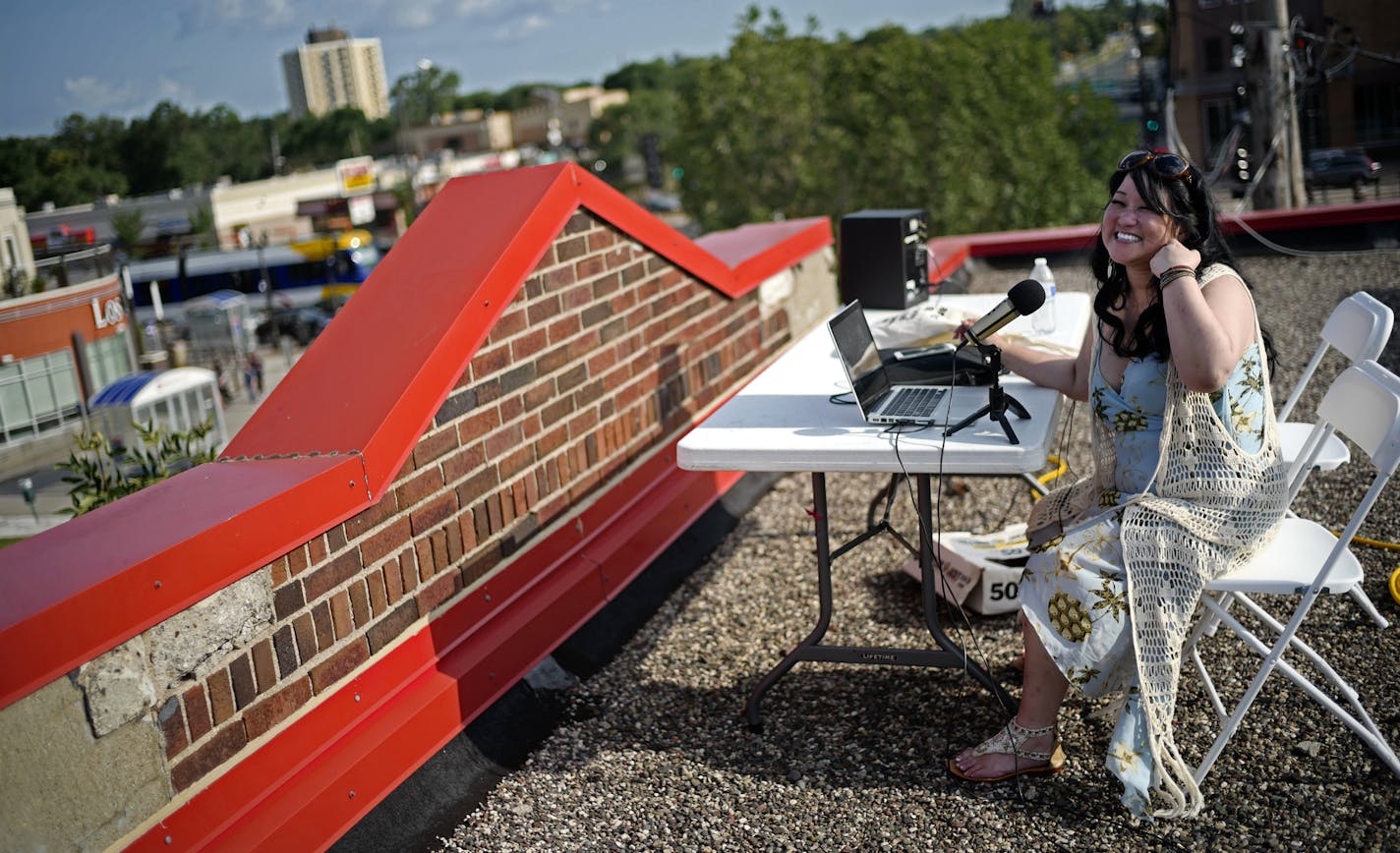 Radio show host Karen Larson streamed a show from the rooftop and also tested out the transmission system.] workers will raise the tower for WFNU Radio, Frogtown's low power neighborhood radio station. For a year now, the station has streamed online. Now, radio listeners will gain access to an array of programming, including community conversations about such provocative topics as the shooting of Philando Castille and the response of St. Paul Police to protesters in front of the Governor's Mansi