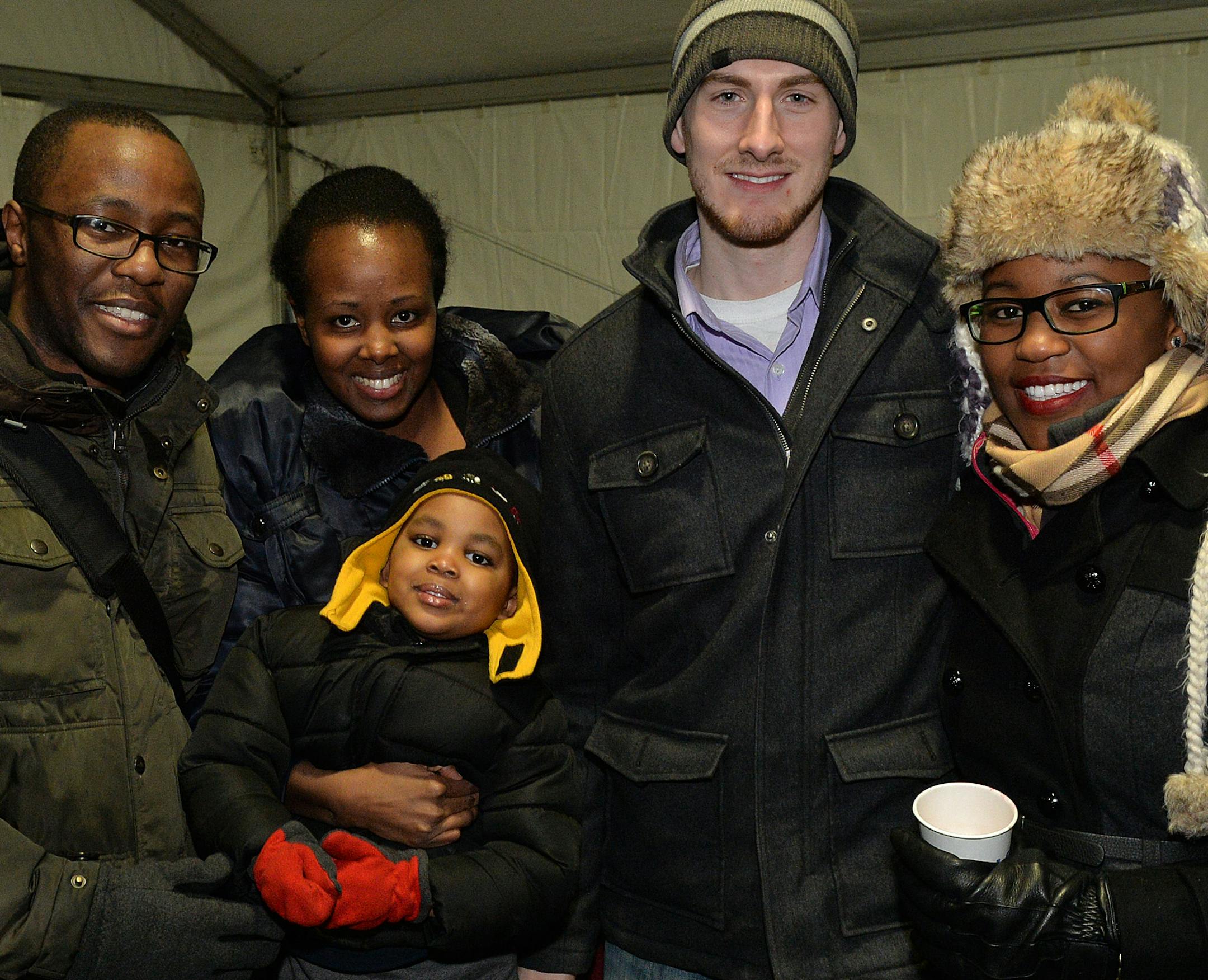 From left to right, Elias, Maureen and William Ndegwa, Jason and Joan Hinricks. ] (SPECIAL TO THE STAR TRIBUNE/BRE McGEE) **Elias Ndegwa (left), Maureen Ndegwa (second from left), William Ndegwa (held, center), Jason Hinricks (second from right), Joan Hinricks (right)