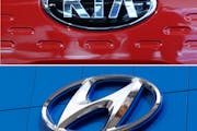 FILE- This combination of file photos shows the logo of Kia Motors, top and Hyundai logo, bottom. Hyundai and Kia are recalling more than 550,000 cars