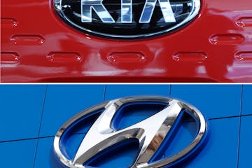 FILE- This combination of file photos shows the logo of Kia Motors, top and Hyundai logo, bottom. Hyundai and Kia are recalling more than 550,000 cars