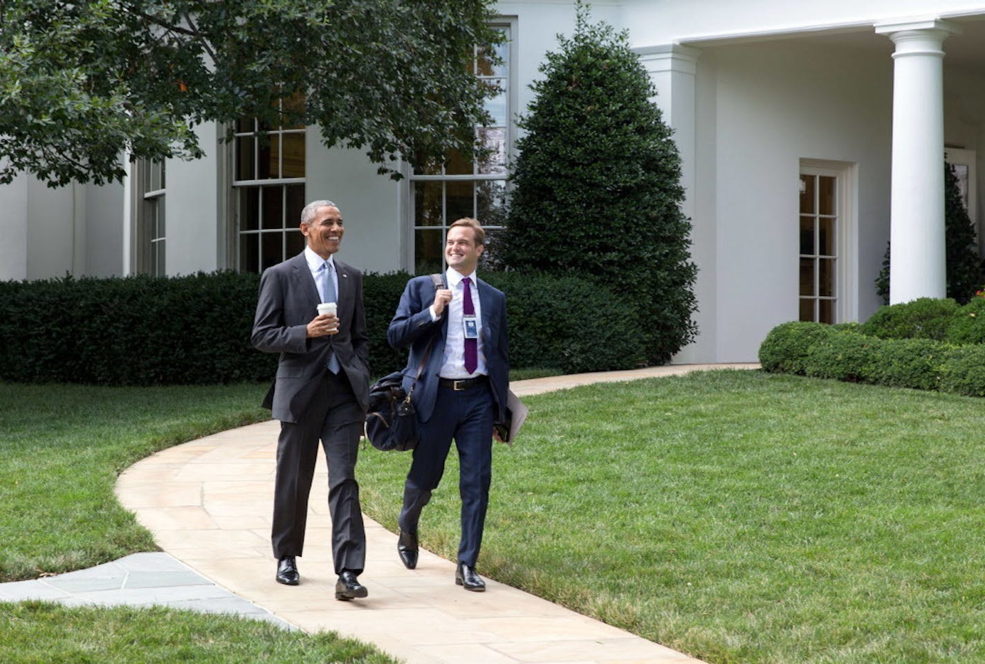 President Obama walks with personal aide Joe Paulsen, a Minnesota native who has been with Obama since the 2007 presidential campaign in Iowa.