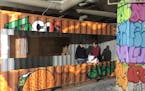 The graffiti-covered food stalls at Cargo Food Authority, shown here under construction, are built out of shipping containers.