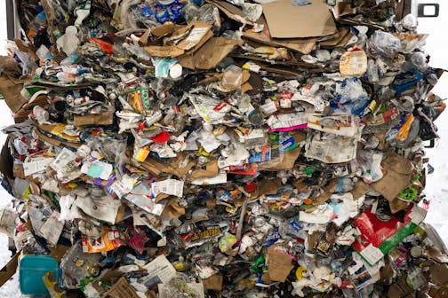 A load of recycling materials is seen coming out of a truck inside the single stream recycling facility at Dem-Con Companies Environmental Campus on Wednesday, April 19, 2023 in Shakopee, Minn. ] LEILA NAVIDI • leila.navidi@startribune.com