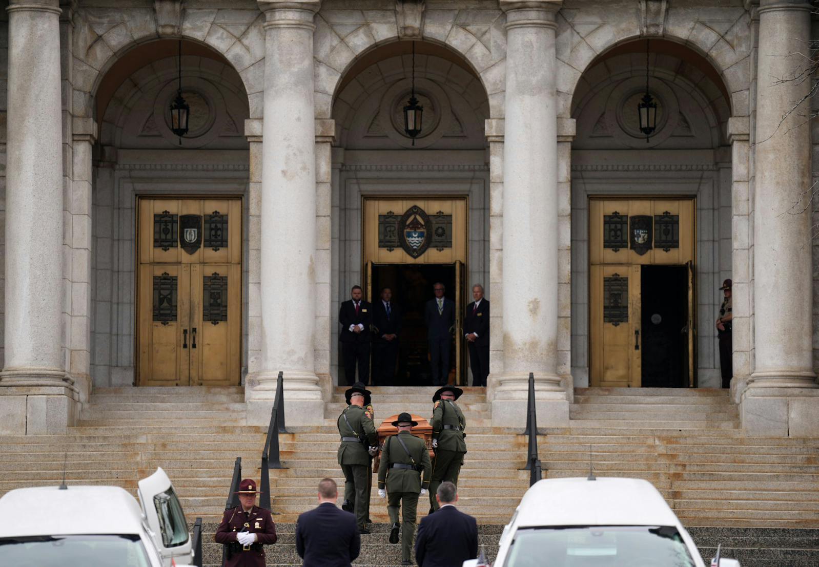 Conservation officers carry the casket of Melissa Hortman into the Basilica of St. Mary before funeral services for Mark and Melissa Hortman in Minneapolis on Saturday.