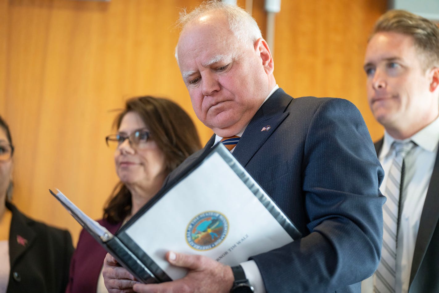 Governor Tim Walz reviews notes before speaking at the State of Minnesota's November 2022 Budget and Economic Forecast Tuesday, Dec. 6, 2022 at the Minnesota Department of Revenue in St. Paul, Minn. ]