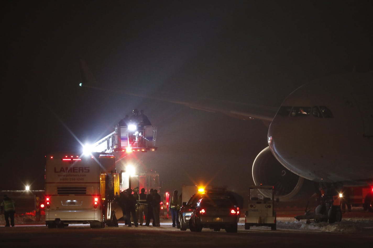 Airport personnel attended to the plane carrying the Minnesota Vikings hours after landing at Appleton International Airport. ] JEFF WHEELER &#xef; jeff.wheeler@startribune.com The Vikings team charter slid off the runway while taxiing after landing at Appleton International Airport Friday night, December 23, 2016 the night before their game against the Green Bay Packers.