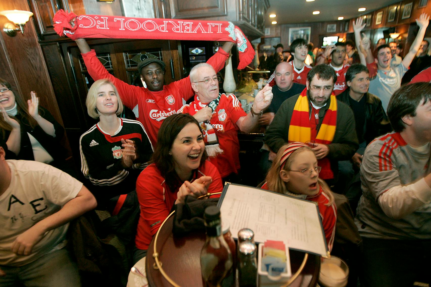 ELIZABETH FLORES• eflores@startribune.com March 14, 2009 - Minneapolis, MN - Soccer fans cheered a 7:30 am live soccer broadcast between Liverpool and Manchester United at Britt’s Pub in downtown Minneapolis.