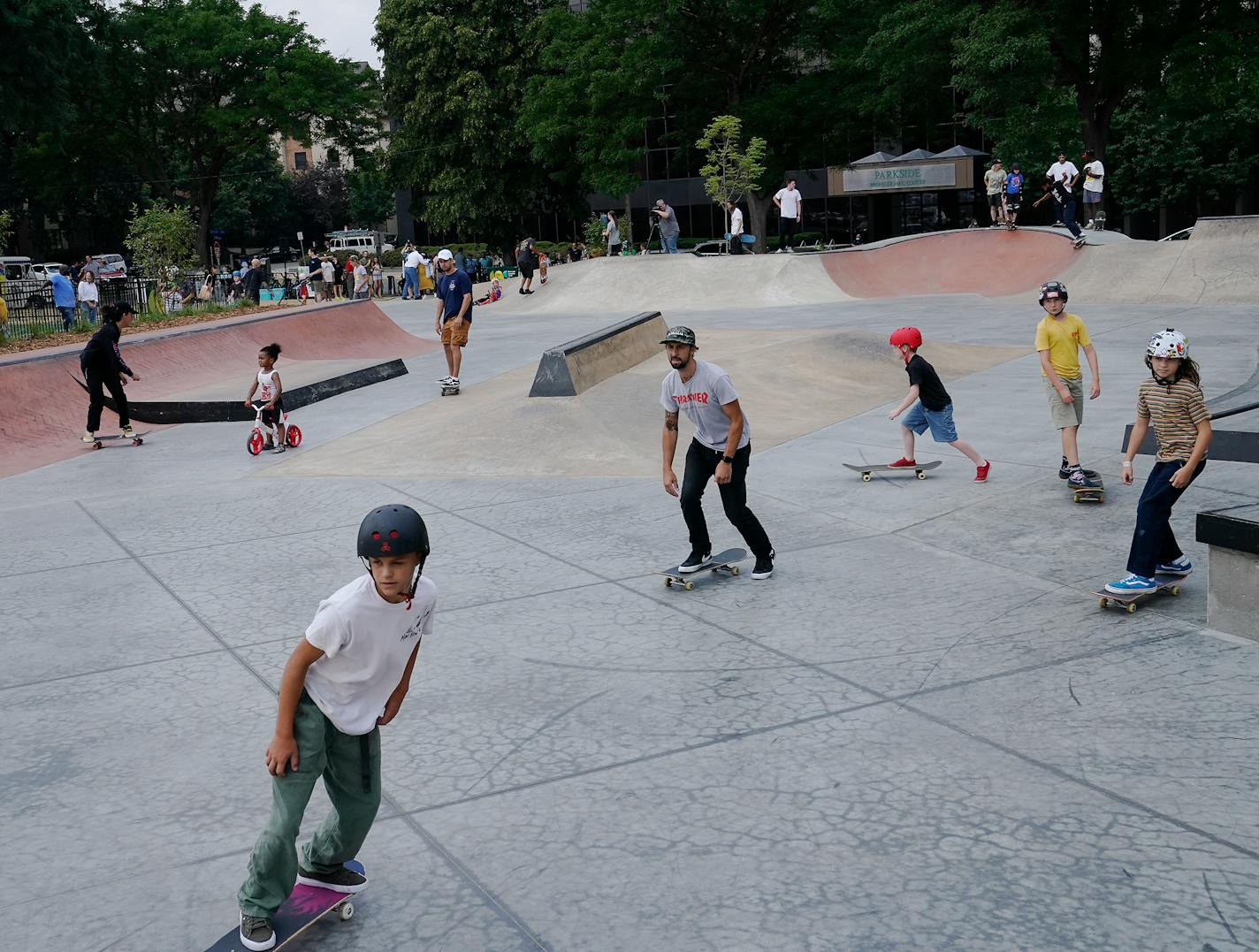 Skateboarders, BMX riders and other shredders took to a new, reopened Minneapolis skate park in the Elliot Park neighborhood following a ribbon cutting ceremony celebrating the park Friday in Minneapolis. ]