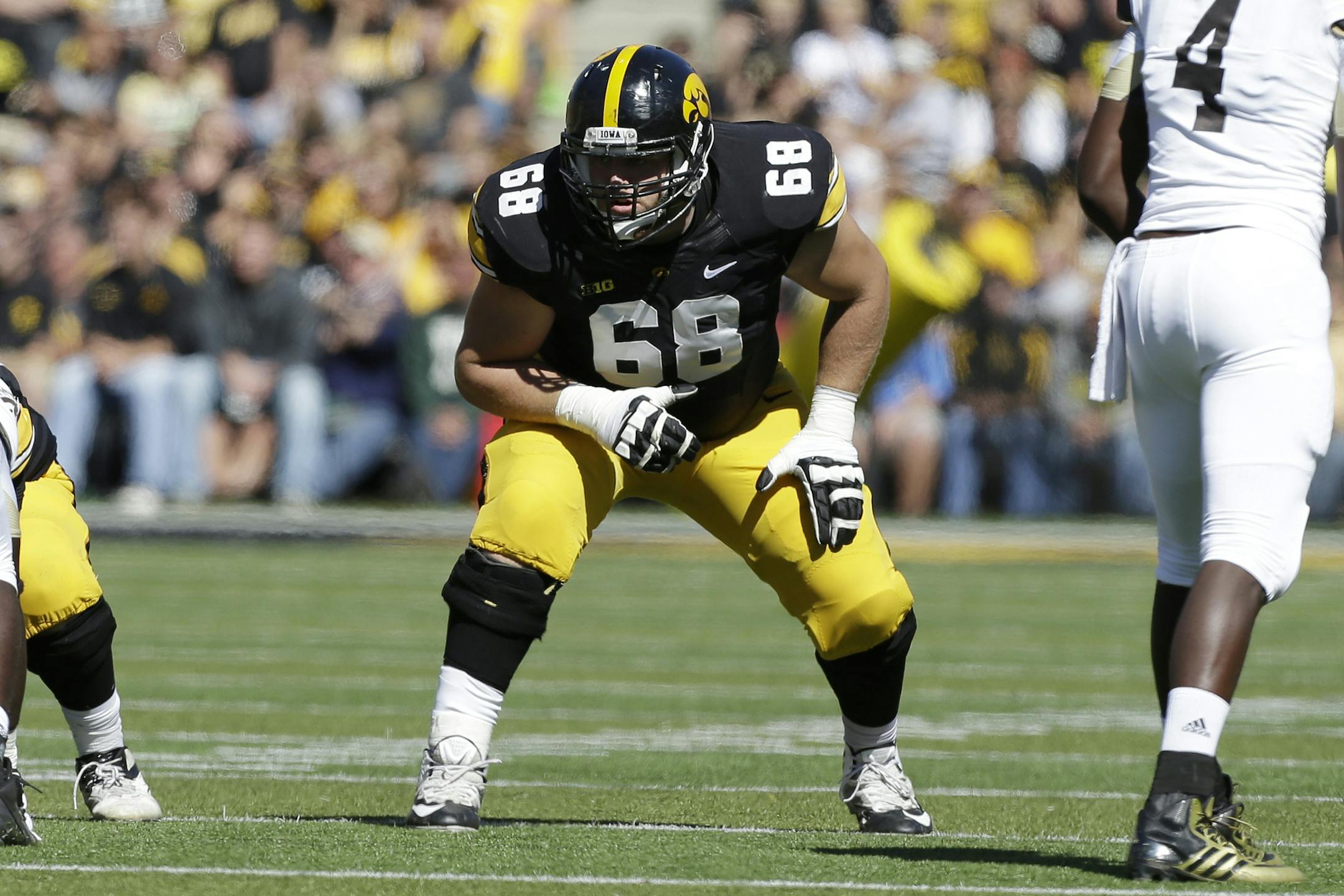 Iowa offensive linesman Brandon Scherff gets set on the line of scrimmage during the first half of an NCAA college football game against Western Michigan, Saturday, Sept. 21, 2013, in Iowa City, Iowa. (AP Photo/Charlie Neibergall) ORG XMIT: IACN1