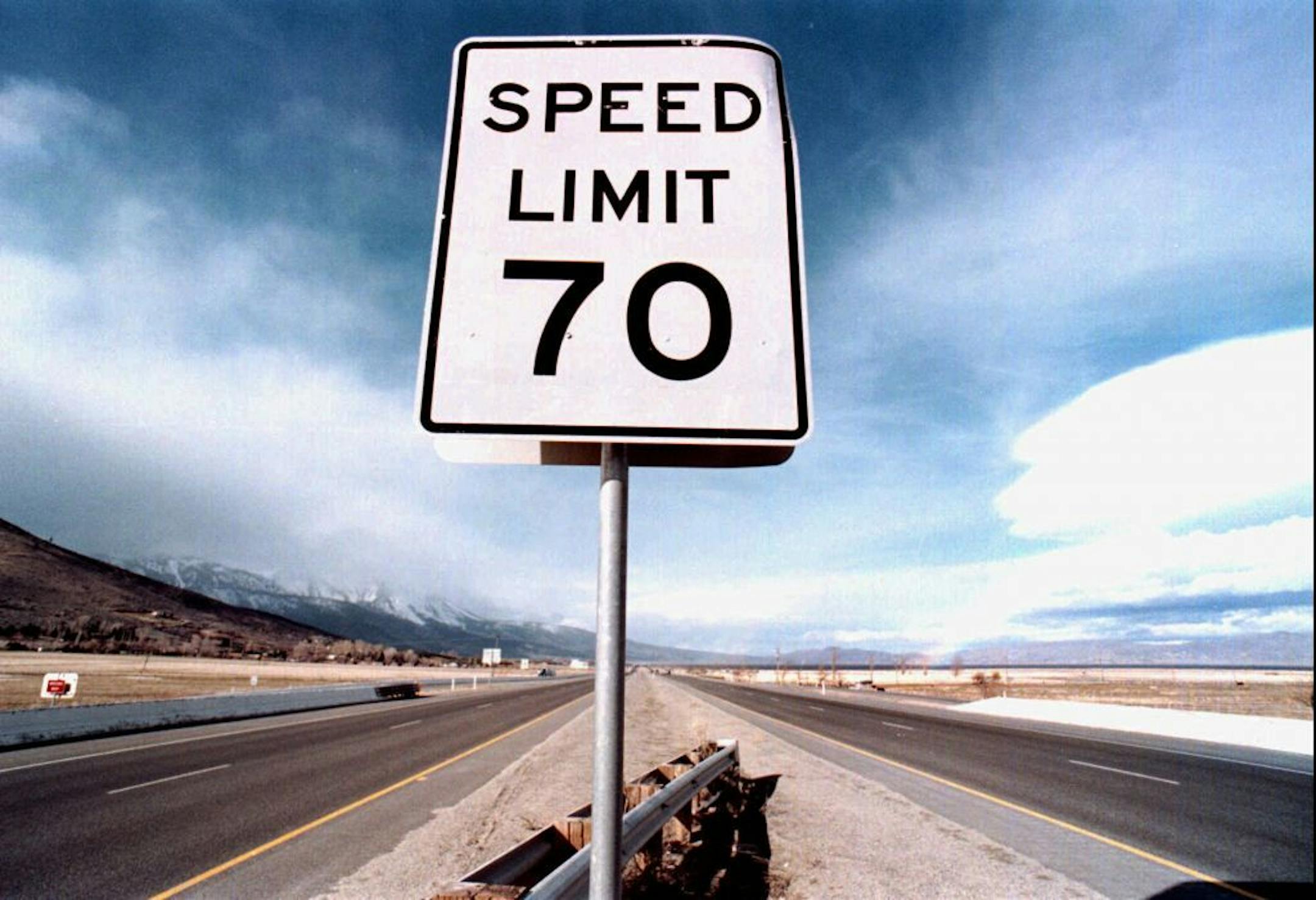 In this Feb. 19, 1997 file photo, a speed limit sign stands tall on the median of Highway 395 North in Washoe Valley, Nev. A reader-submitted question about why the candidates and commentators aren't pushing the idea of a nationwide 55 mph speed limit is being answered as part of an Associated Press Q&A column called "Ask AP."