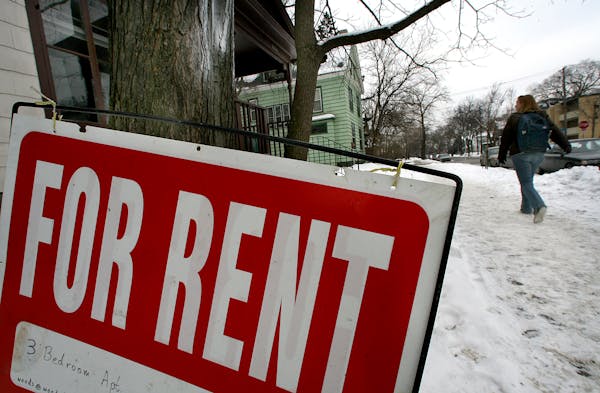 A “for rent” sign is posted in front of a home in Minneapolis.