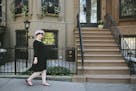 More concerned about protecting her tresses than adhering to style dictates, Aly Walansky sports a shower cap through her neighborhood in New York.