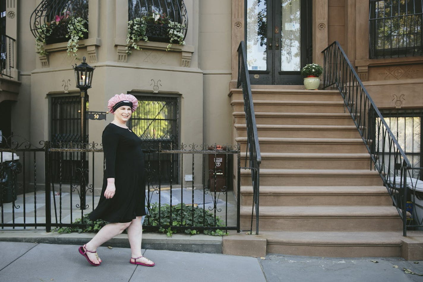 More concerned about protecting her tresses than adhering to style dictates, Aly Walansky sports a shower cap through her neighborhood in New York.