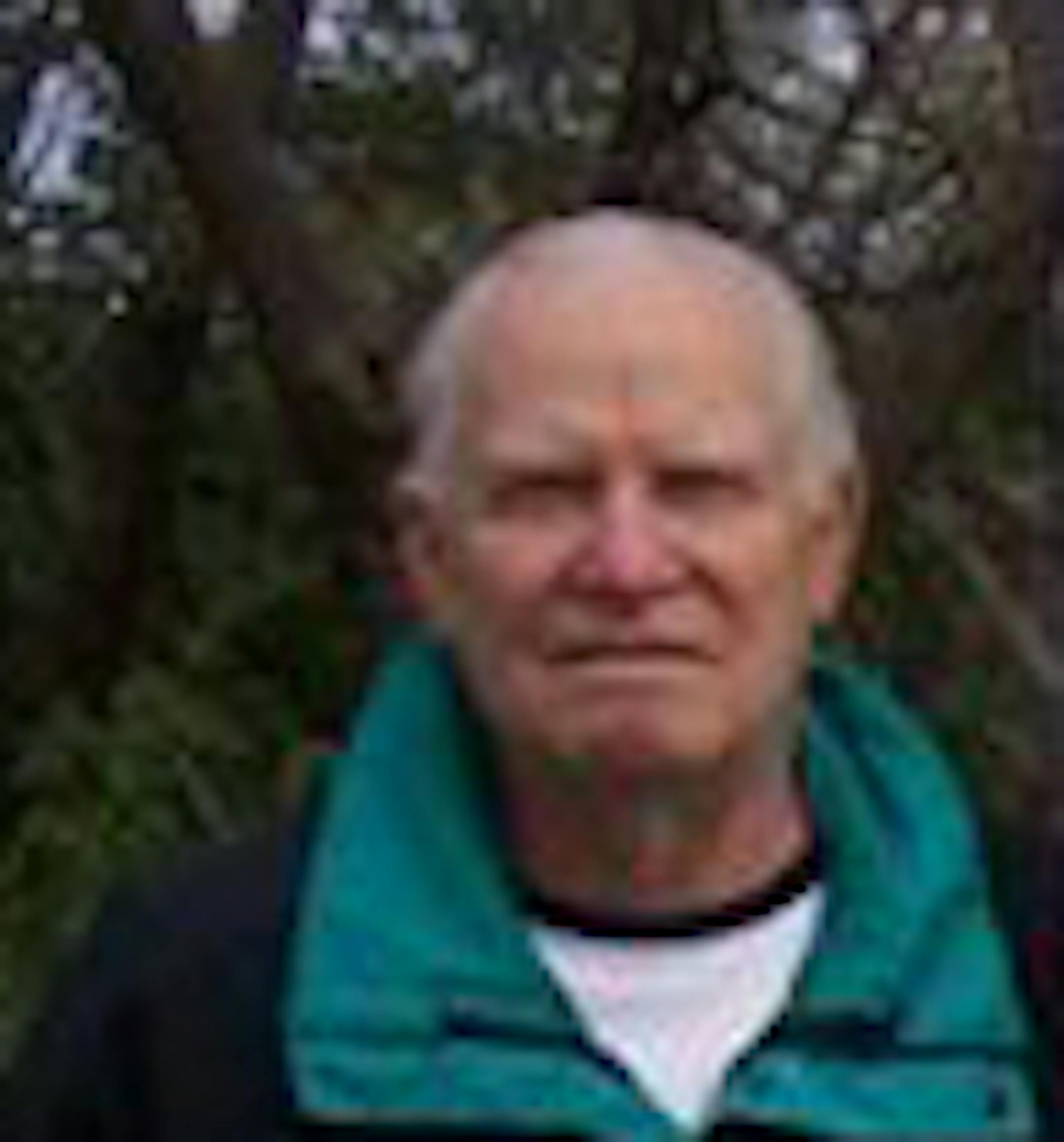 Lloyd Ohme stands in front of the sign of the new Minneapolis Rowing Club boat club, which was completed in 2007 and is named after him. (family handout)