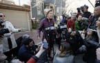 Sen. Elizabeth Warren, D-Mass., speaks to the media outside her home, Thursday, March 5, 2020, in Cambridge, Mass., after she dropped out of the Democ