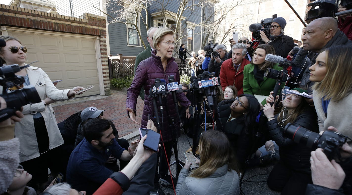 Sen. Elizabeth Warren, D-Mass., speaks to the media outside her home, Thursday, March 5, 2020, in Cambridge, Mass., after she dropped out of the Democratic presidential race. (AP Photo/Steven Senne)