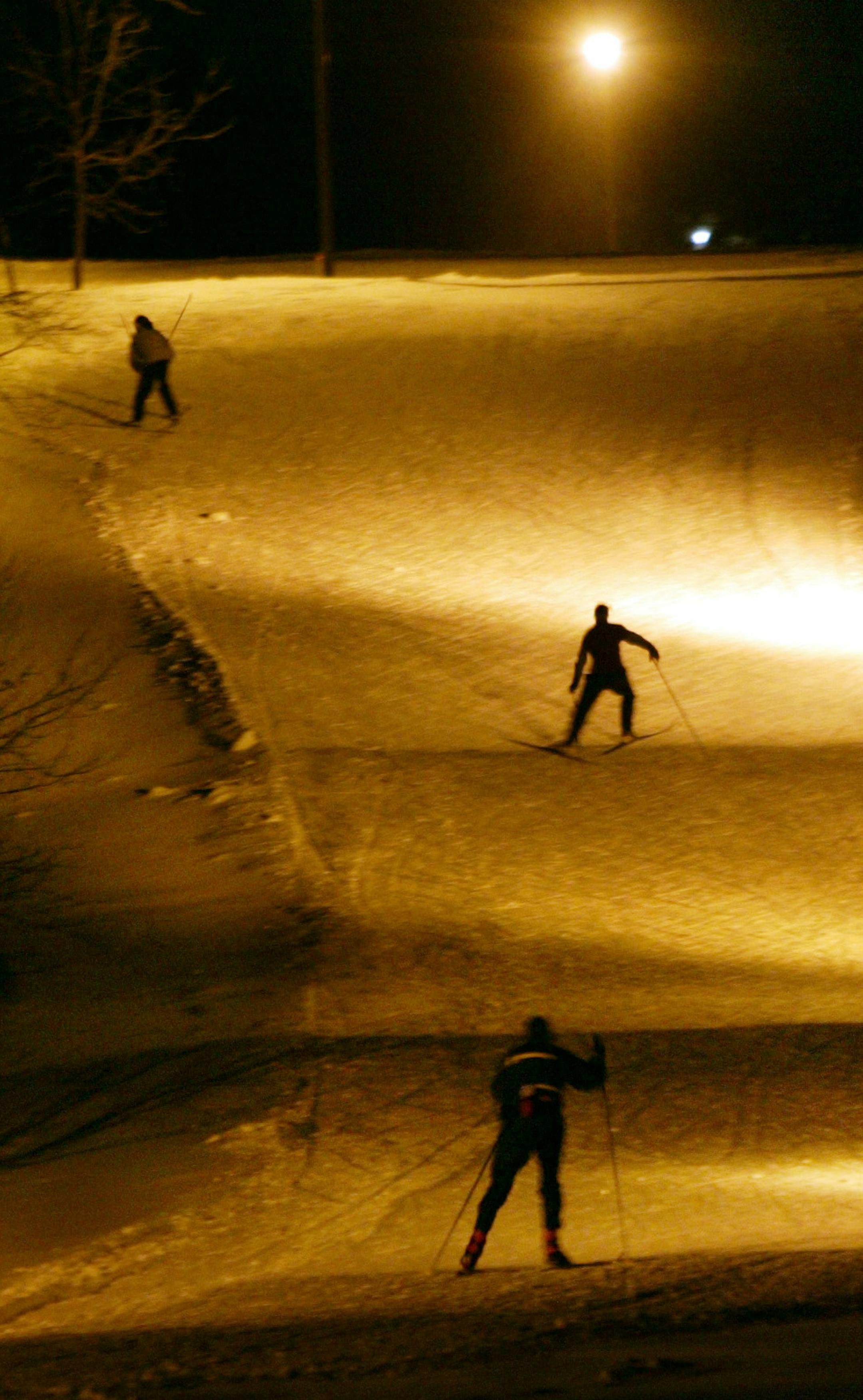 12/10/03- Maple Grove, MN- Nordic skiers have an eighteen inch base to ski on thanks to Three Rivers Park officials who decided to add snowmaking machines to a trail at Elm Creek Park Reserve in Maple Grove. Night skiing at the park has been popular with recreational skiers and high school ski teams who come to train on the trail.
