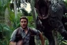 Chris Pratt runs from a dino in "Jurassic World."