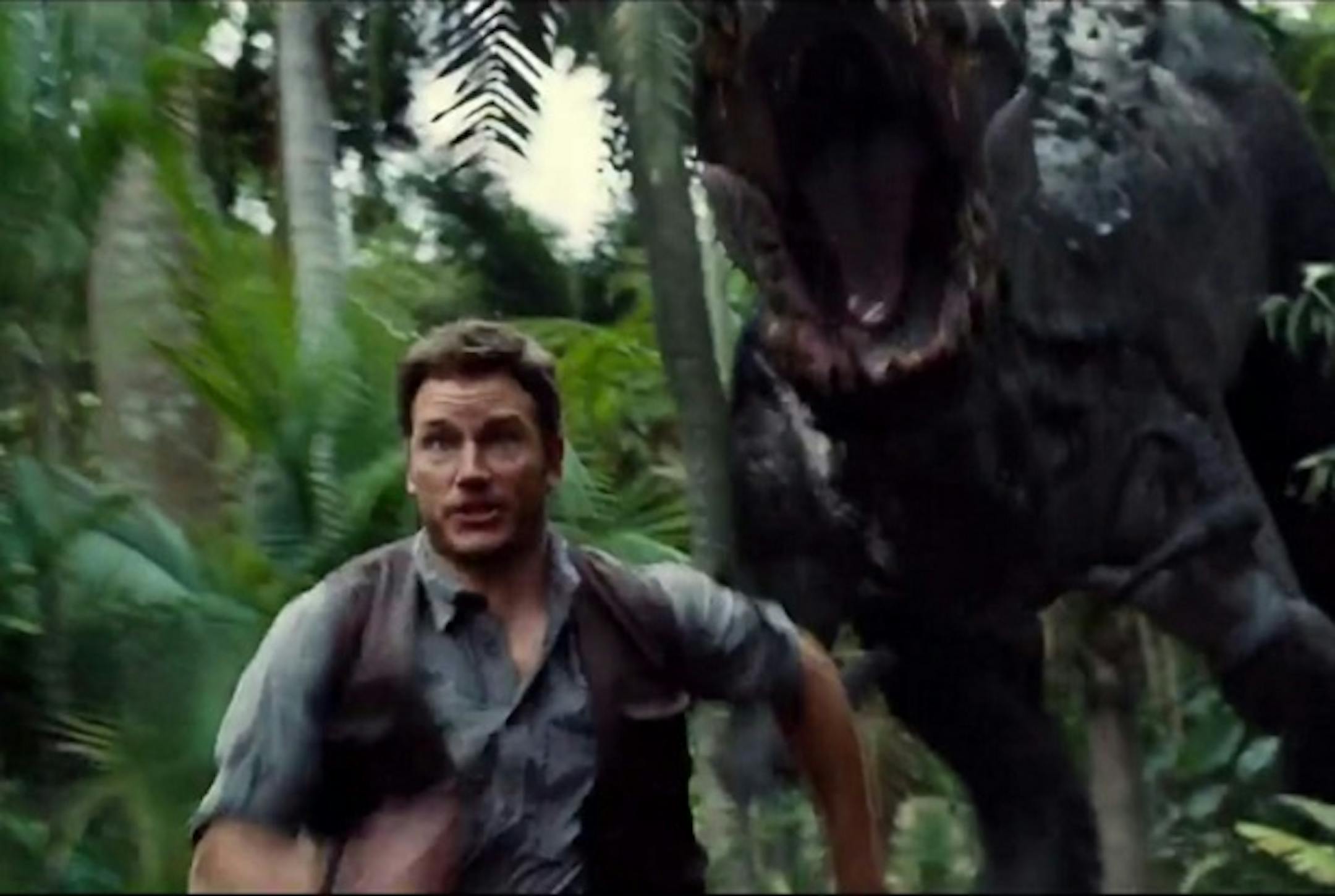 Chris Pratt runs from a dino in "Jurassic World."