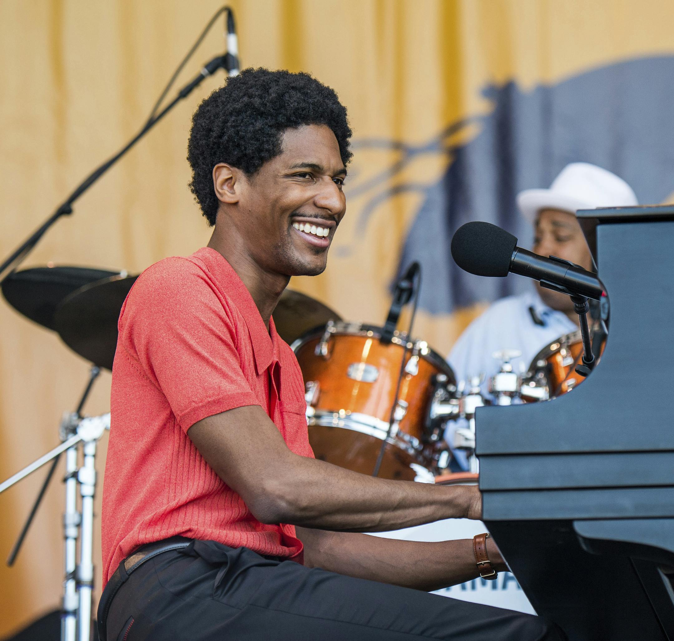 Jon Batiste performs during the Tribute to Fats Domino at the New Orleans Jazz and Heritage Festival on Saturday, April 28, 2018, in New Orleans. (Photo by Amy Harris/Invision/AP)