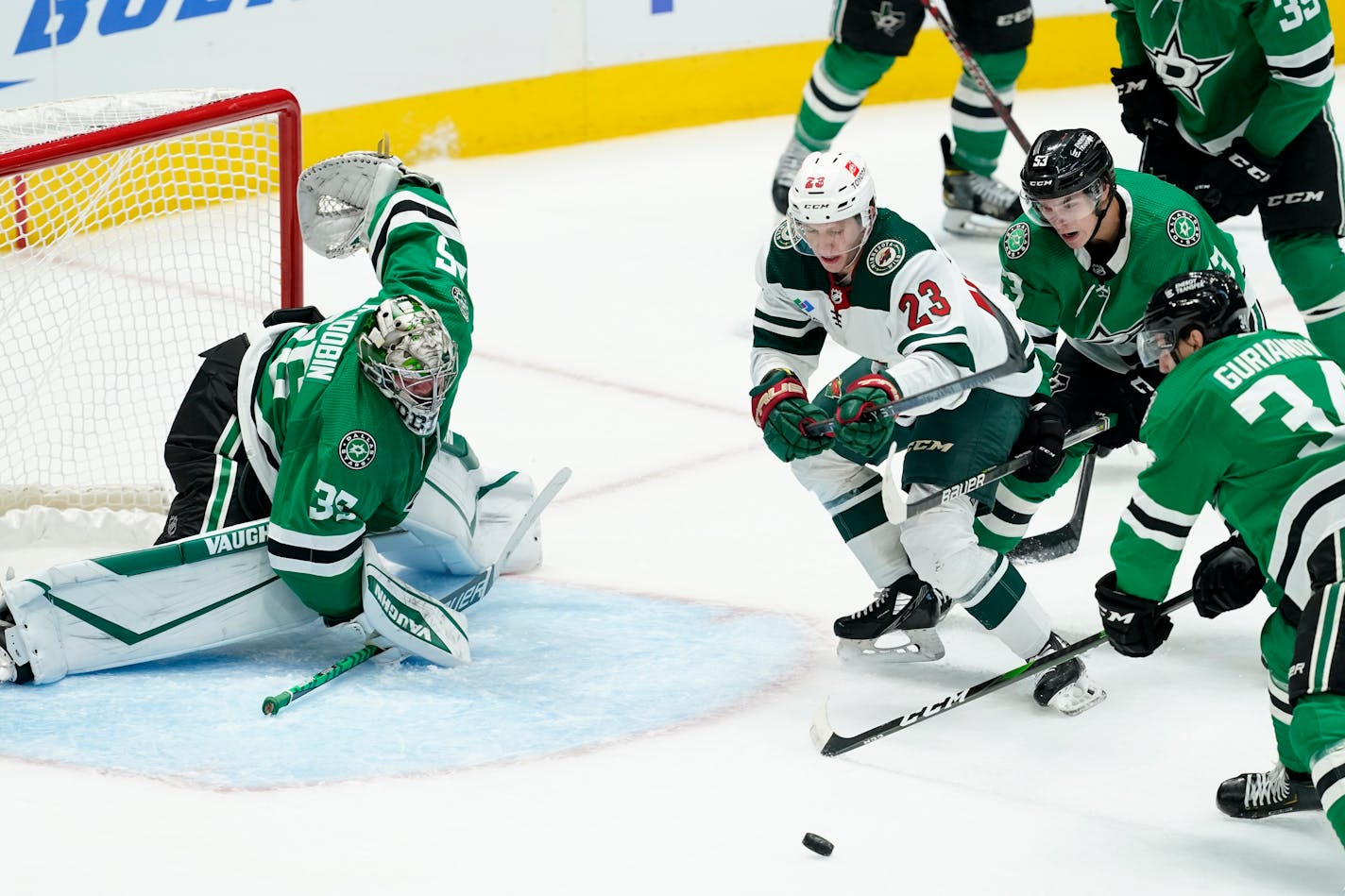 Wild center Marco Rossi (23) is defended by Dallas goaltender Anton Khudobin during the second period of Thursdays preseason game. Rossi scored shorthanded earlier.