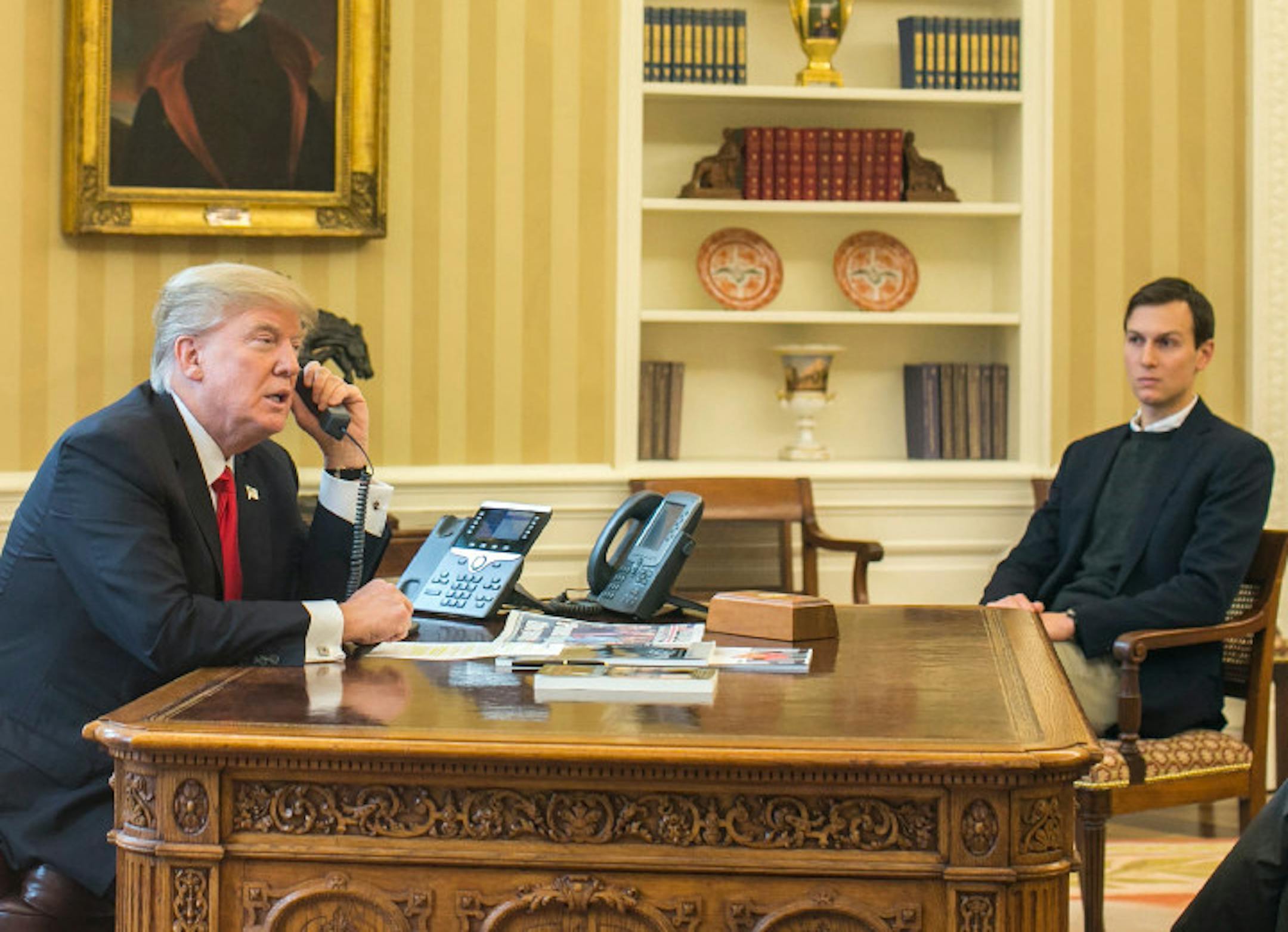 President Donald Trump, accompanied by Jared Kushner, a senior adviser to the president, speaks on the phone with King Salman of Saudi Arabia, in the Oval Office of the White House in Washington, Jan. 29, 2017.