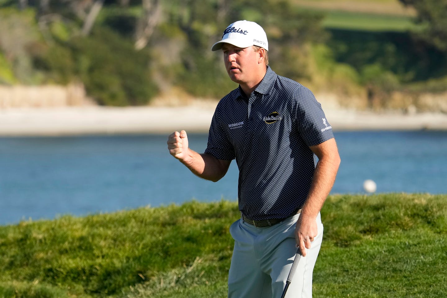 Tom Hoge reacts after he birdies the 17th hole of the Pebble Beach Golf Links during the final round of the AT&amp;T Pebble Beach National Pro-Am golf tournament in Pebble Beach, Calif., Sunday, Feb. 6, 2022. (AP Photo/Tony Avelar)