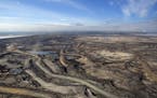 Expansive aerial view of a pit mining project in Alberta's Oilsands near Fort McMurray.