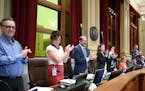 Some Minneapolis City Council members applauded in May after the council unanimously approved a sick-leave ordinance.