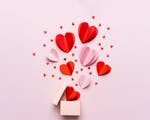 Valentine day composition with gift box and red hearts, photo template on pink background. istock