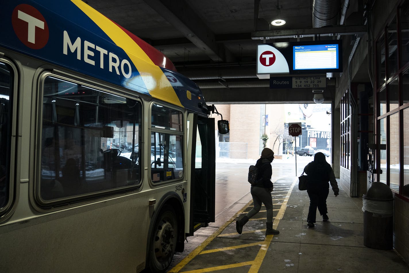 People get off the a C-line bus at the same stop a gunman got on a bus the night before and shot two people in Minneapolis, Minn. Photographed on Friday, February 7, 2020. ] RENEE JONES SCHNEIDER &#xa5; renee.jones@startribune.com