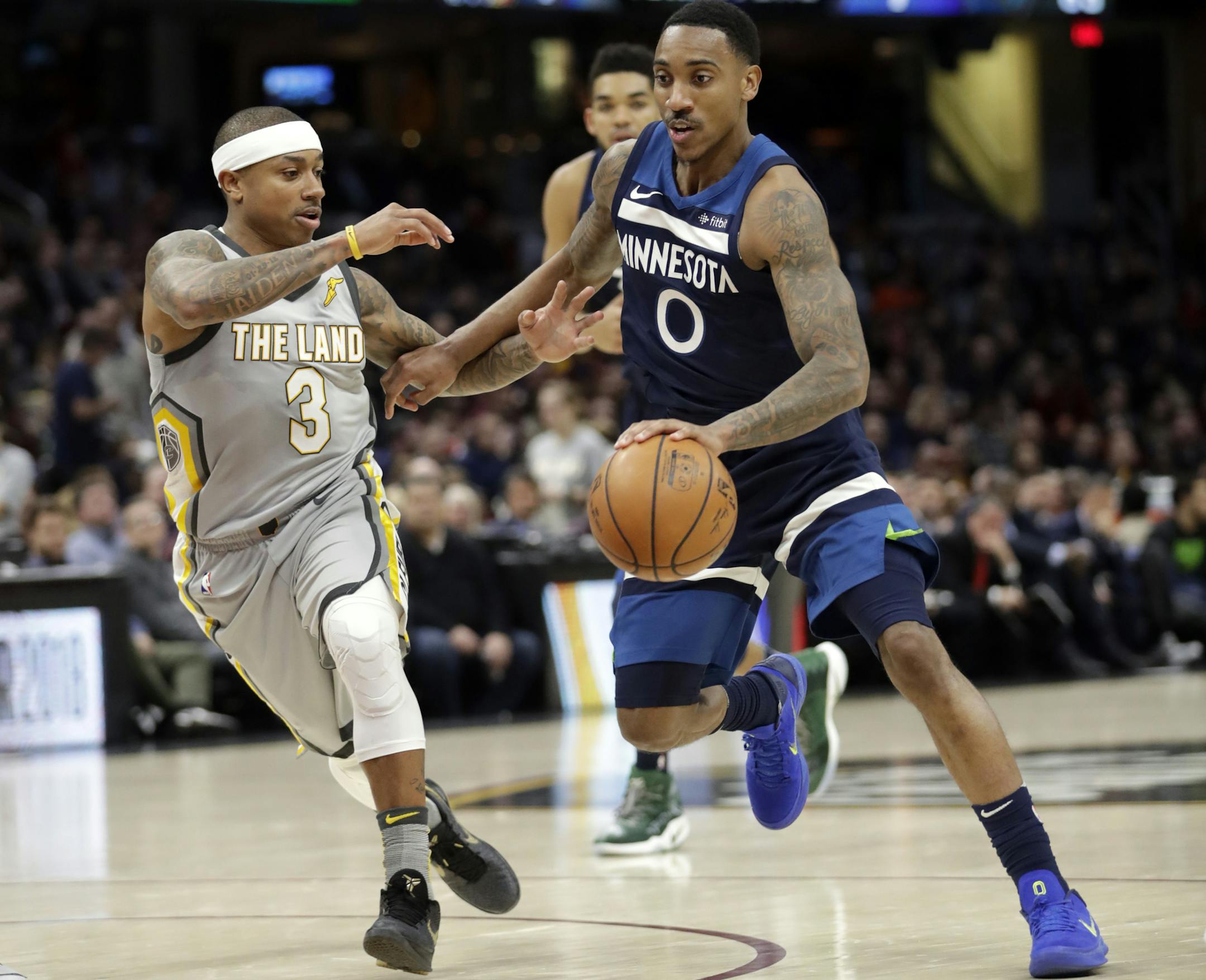 Minnesota Timberwolves' Jeff Teague (0) drives past Cleveland Cavaliers' Isaiah Thomas (3) in the second half of an NBA basketball game, Wednesday, Feb. 7, 2018, in Cleveland. The Cavaliers won 140-138 in overtime. (AP Photo/Tony Dejak)