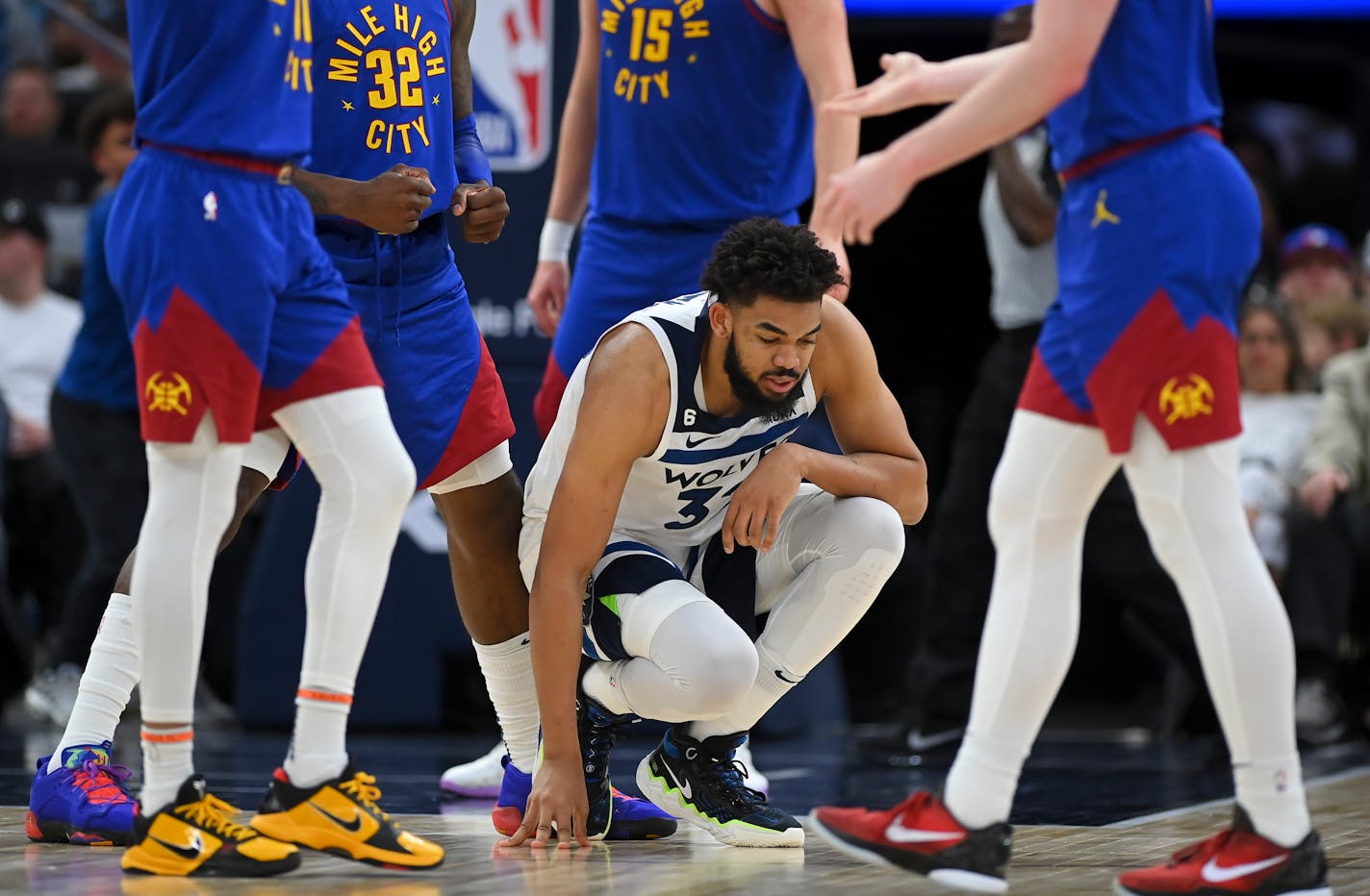 Minnesota Timberwolves center Karl-Anthony Towns (32) is slow to get up after a sequence resulting in a Wolves turnover against the Denver Nuggets in the second half Friday, April 21, 2023, at Target Center in Minneapolis, Minn.. The Minnesota Timberwolves were defeated 120-111 by Denver, falling to 0-3 in the series. ] AARON LAVINSKY • aaron.lavinsky@startribune.com