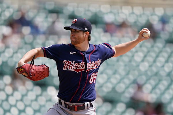 Minnesota Twins starting pitcher Charlie Barnes throws during the first inning of the first baseball game of a doubleheader against the Detroit Tigers