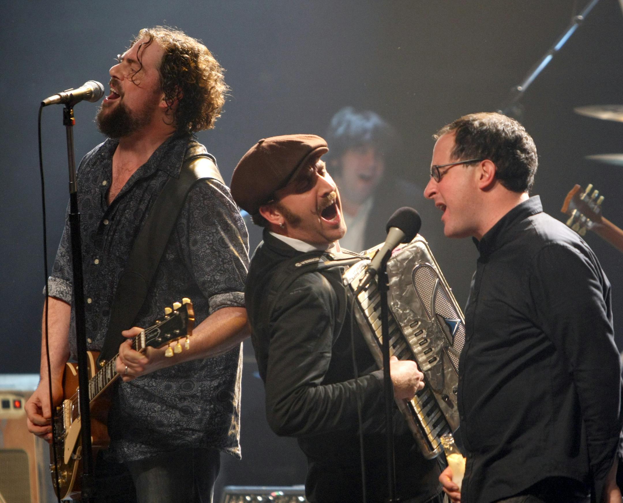 Drive Steady: During an encore at their Saturday concert at First Avenue, Patterson Hood of the Drive-By Truckers, left, played with Franz Nicolay and Craig Finn of the Hold Steady.