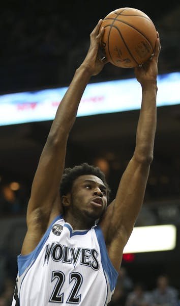 Timberwolves guard Andrew Wiggins dunked over Sacramento Kings forward Quincy Acy in the first quarter Wednesday night. ] JEFF WHEELER &#xef; jeff.whe