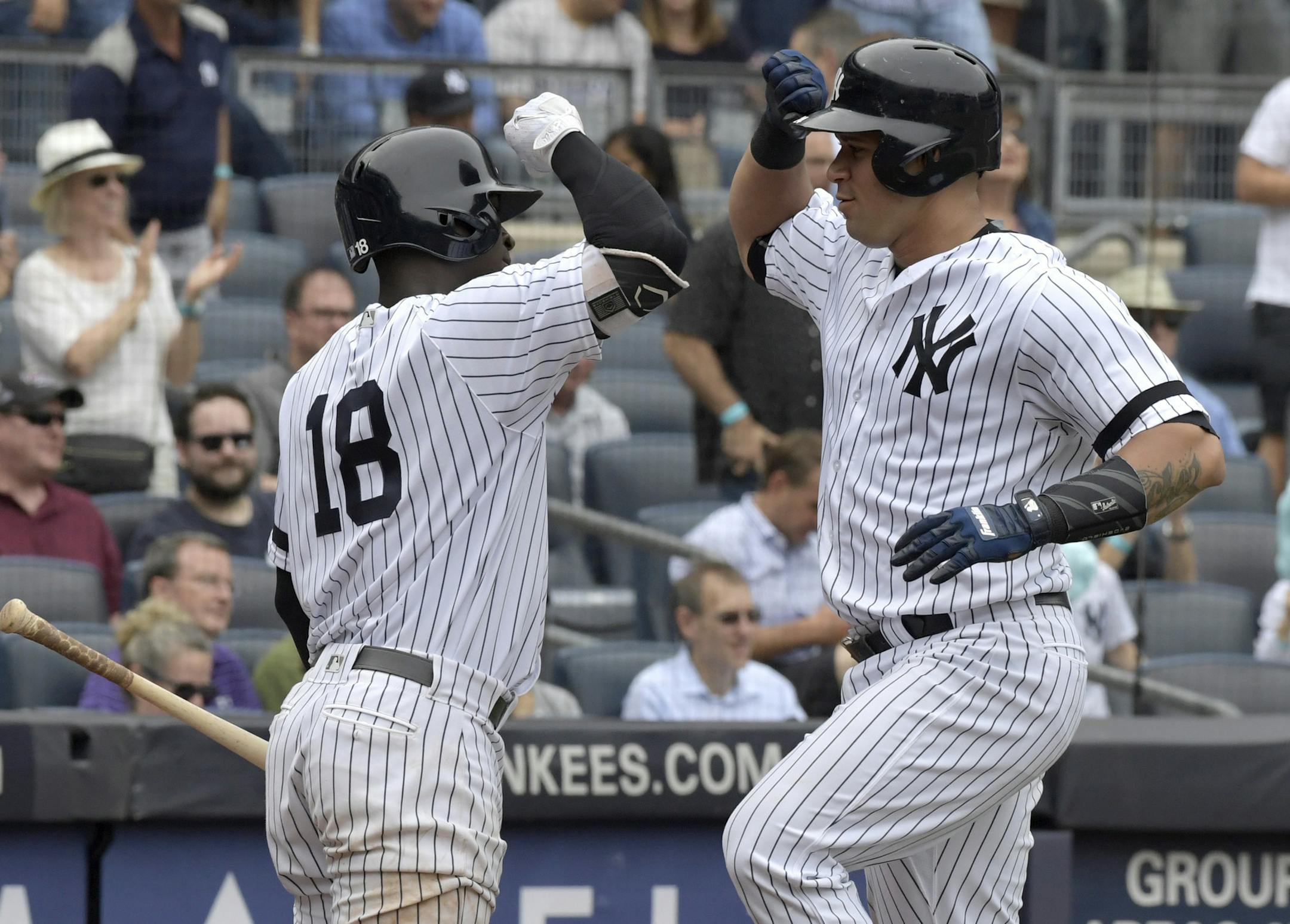 New York Yankees' Gary Sanchez, right, celebrates with' Didi Gregorius after Sanchez hit a home run during the third inning of a baseball game against the Minnesota Twins, Wednesday, Sept. 20, 2017, at Yankee Stadium in New York. (AP Photo/Bill Kostroun)