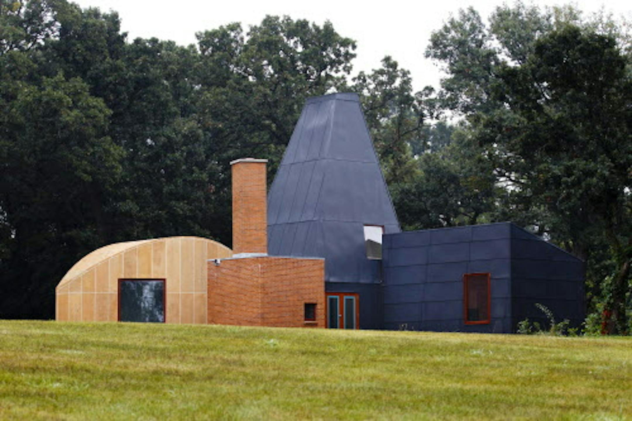 credit: Mike Ekern, University of St. Thomas The Winton Guest House, designed by renowned architect Frank Gehry, stands assembled in its final location at the University of St. Thomas' Gainey Center in Owatonna, Minn. August 31, 2011. The house was moved, in pieces, to this spot from its original location in Orono, Minn.
