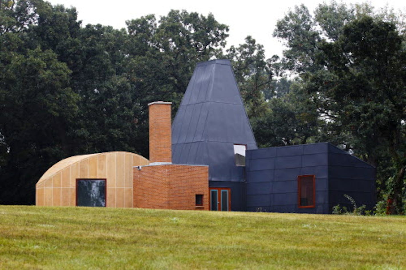 credit: Mike Ekern, University of St. Thomas The Winton Guest House, designed by renowned architect Frank Gehry, stands assembled in its final location at the University of St. Thomas' Gainey Center in Owatonna, Minn. August 31, 2011. The house was moved, in pieces, to this spot from its original location in Orono, Minn.