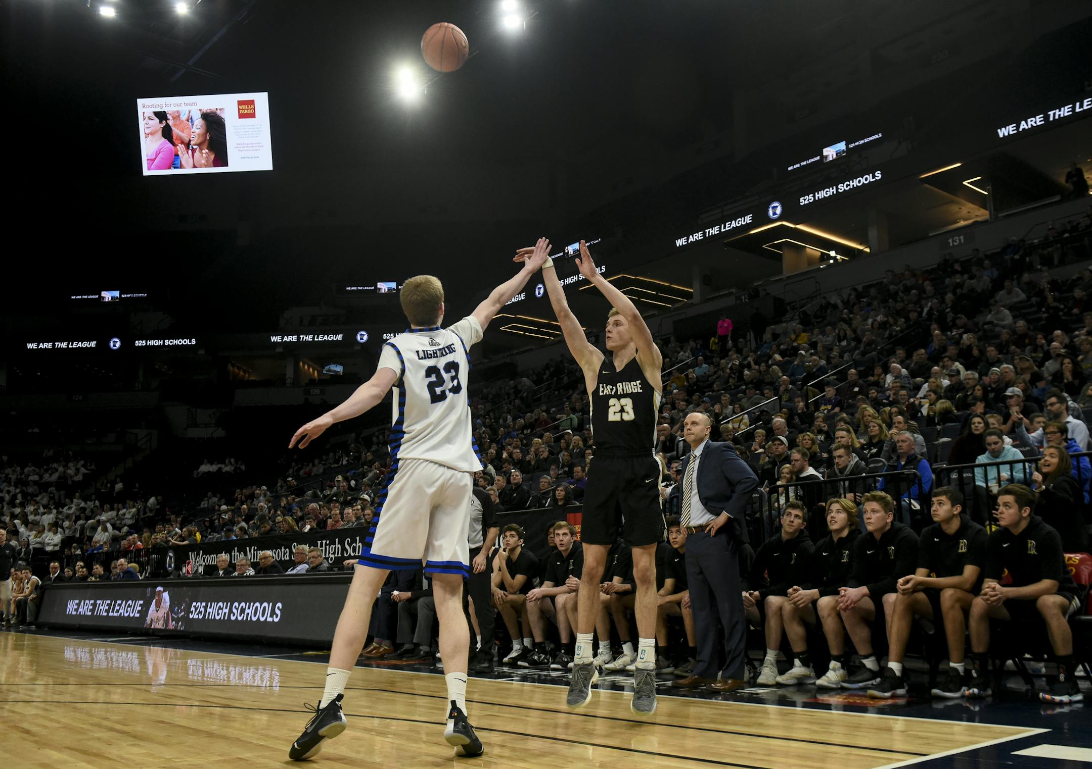 East Ridge forward Ben Carlson (23) scored a 3-pointer over Eastview forward Steven Crowl (23) early in the second half. ] Aaron Lavinsky ¥ aaron.lavinsky@startribune.com East Ridge played Eastview in a Class 4A state tournament quarterfinal game on Wednesday, March 20, 2019 at Target Center in Minneapolis, Minn.