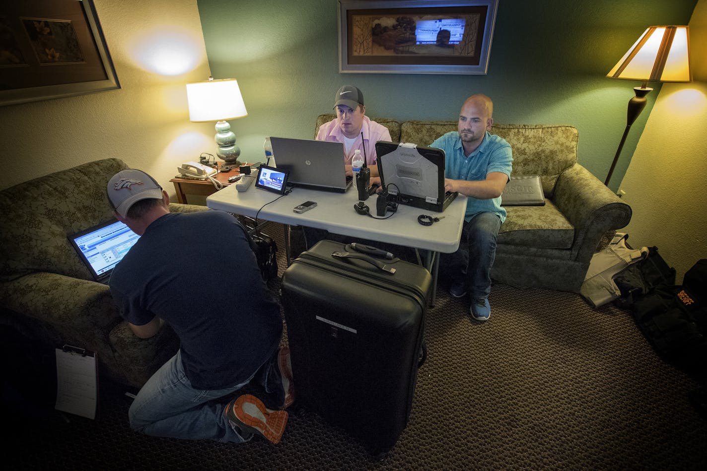 Officers from multiple agencies waited in a hotel room during a prostitution sting in St. Peter, MN. ] CARLOS GONZALEZ &#xef; cgonzalez@startribune.com - May 31, 2017, St. Peter, MN, Southern Minnesota law enforcement agencies are ramping up sex trafficking stings as officers across Minnesota try to tackle decreasing the demand for buying sex. Three counties have teamed up to focus on the supply side of the crime with targeted stings at apartments, trailer homes & hotels. It's supported by a gra