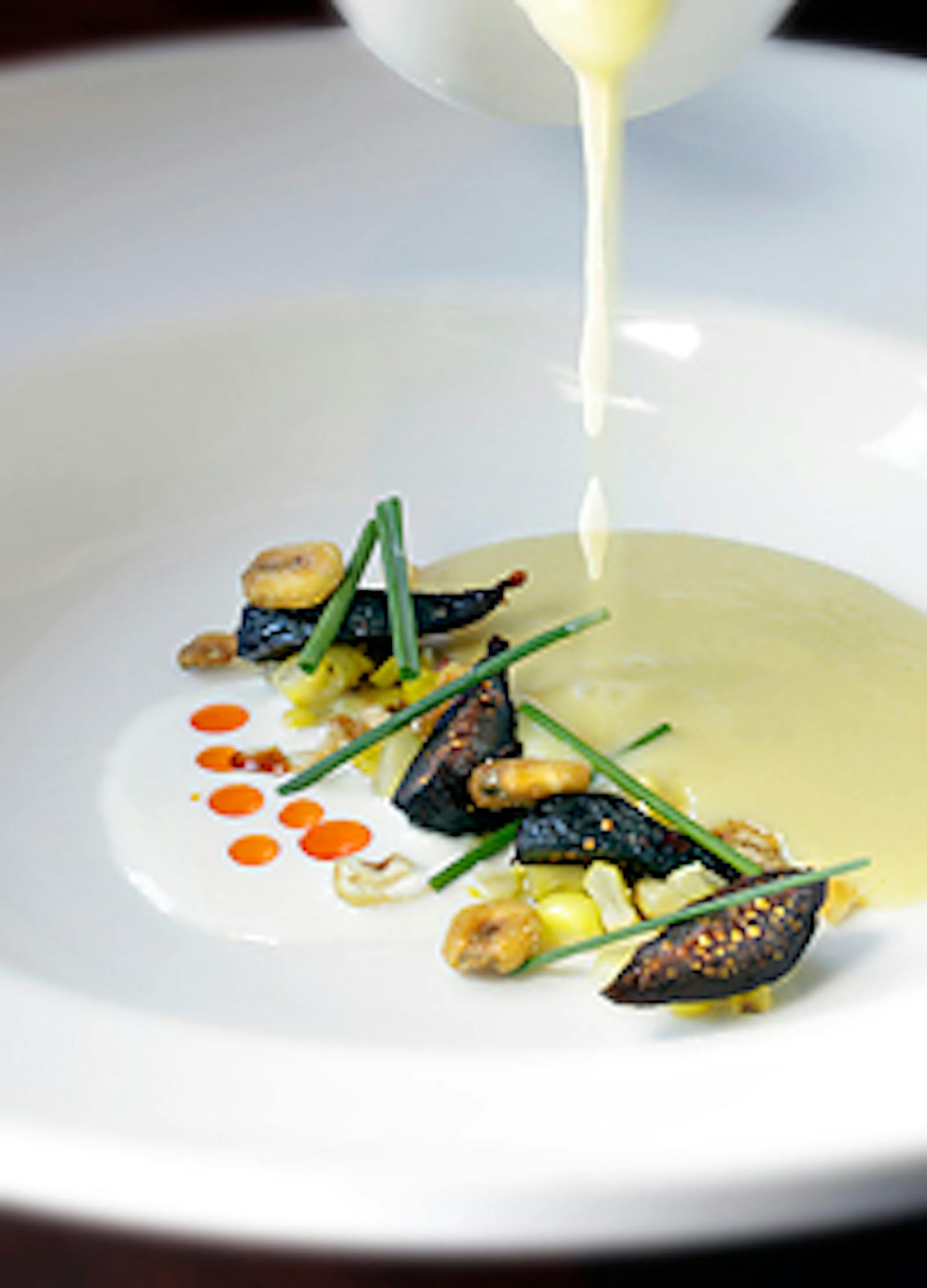 Sweet corn soup with spicy poached black figs, yogurt and smoked paprika