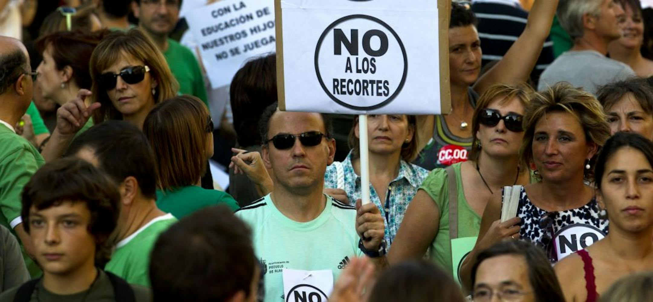 Protesters march during a demonstration against education cuts in Madrid Wednesday Sept. 14, 2011. Thousands of teachers and students demonstrated in Madrid against staffing cuts blamed on austerity cuts as Europe's debt crisis threatens the nation's financial viability. The protest Wednesday night came ahead of a teachers' strike involving 400 Madrid schools planned for Sept. 20 and Sept. 21. Banner reads 'No to Cuts'.
