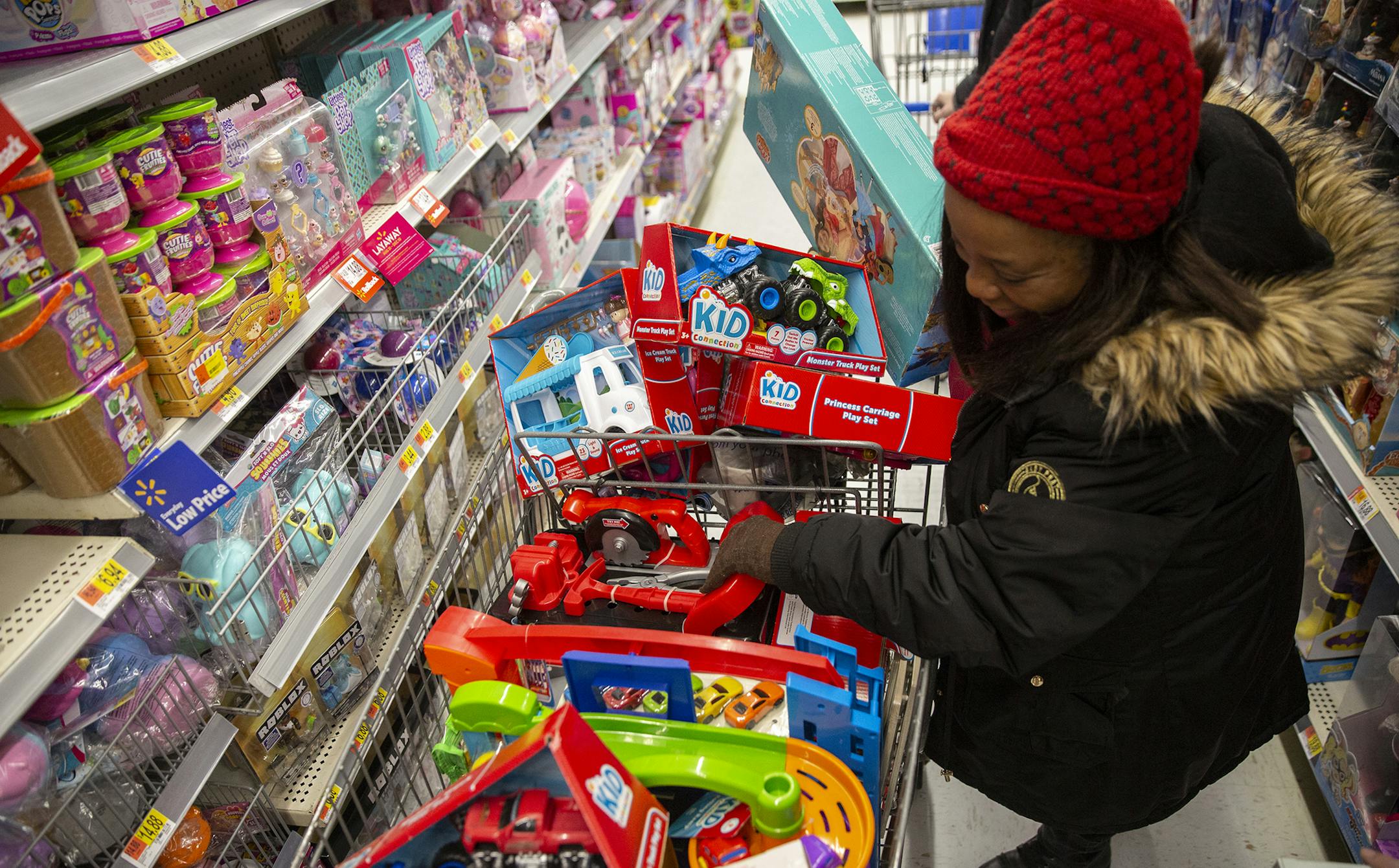 Sharon Woods rummages through a shopping cart at a Philadelphia Walmart Friday. Walmart workers have formed OUR Walmart, which aims to fight for better wages and working conditions. Earlier this year, more than 30,000 Toys R Us workers got laid off, without severance, as the company started the process to shut down all its stores. (Heather Khalifa/Philadelphia Inquirer/TNS)