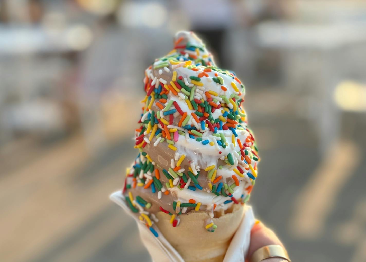 Sprinkles soft serve chocolate/vanilla twist with rainbow sprinkles in a plain cone at the new Roseville ice cream stand.