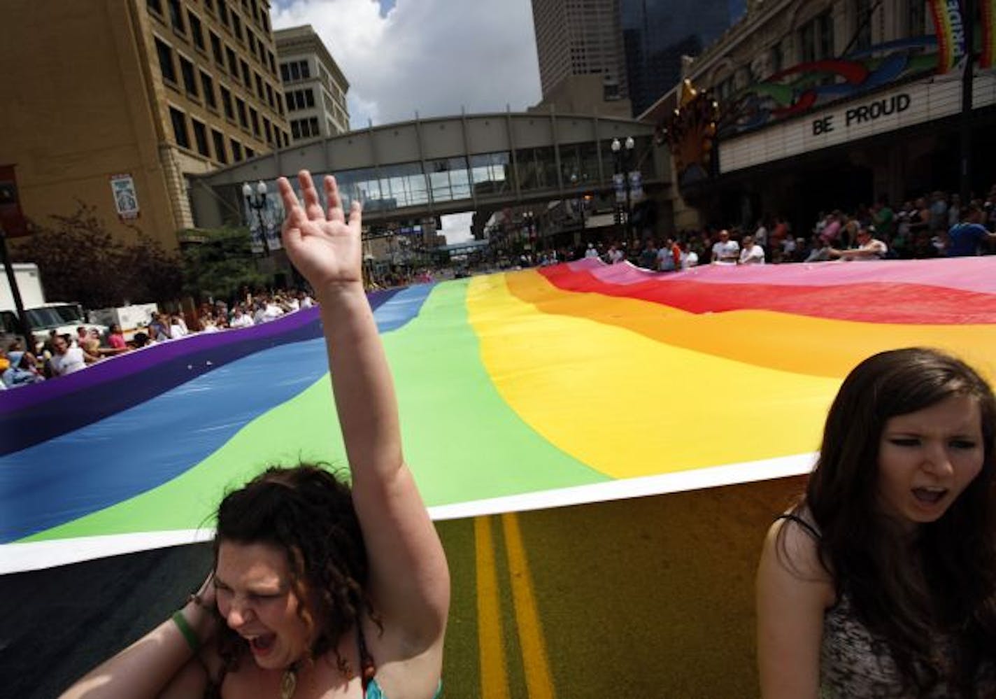 Marchers carried a giant rainbow flag during the GLBT Pride Parade last June in Minneapolis.