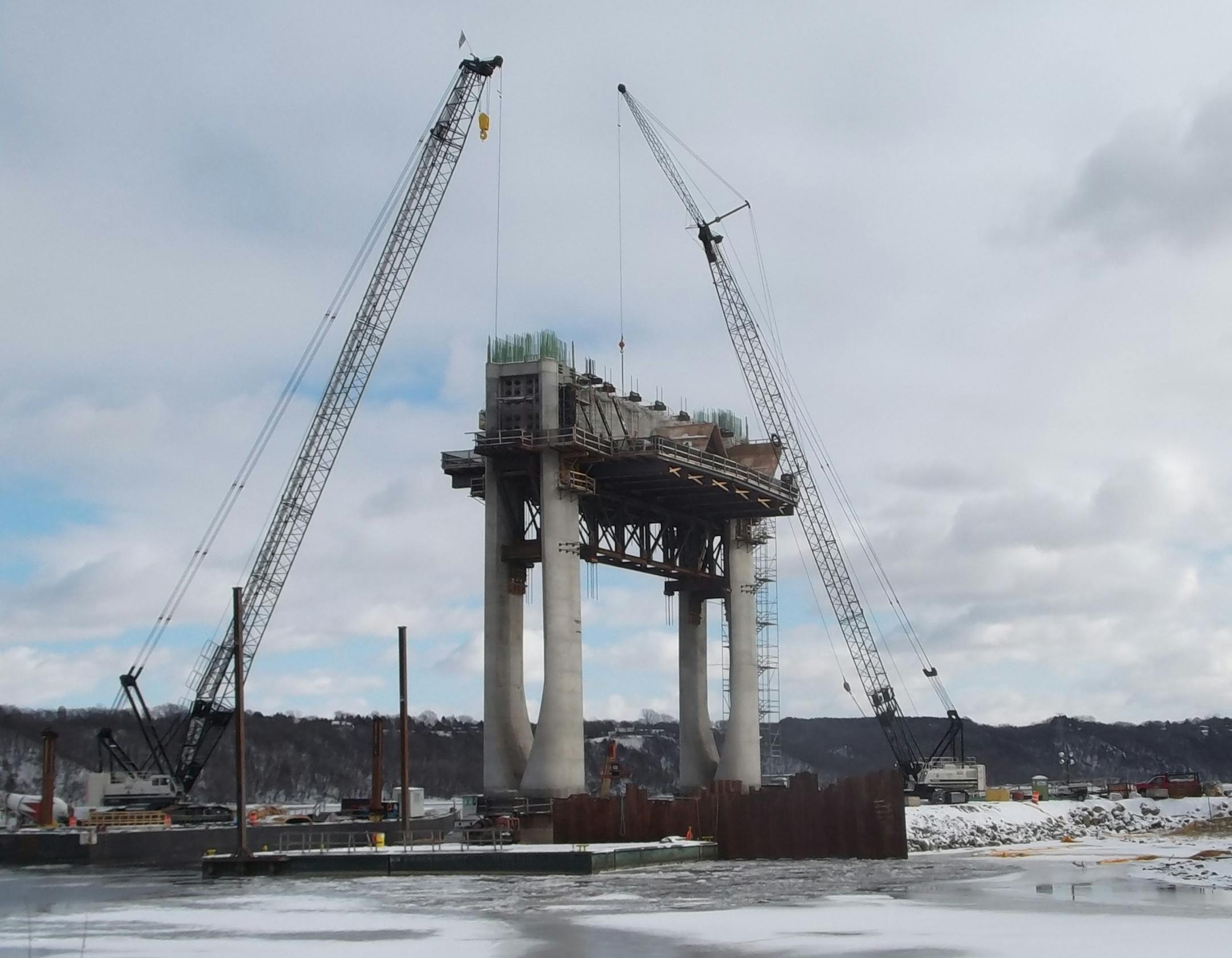 Pier 8, closest to the Minnesota side of the river, has risen to the height of the bridge deck. The tallest pier will measure 159 feet from the water to the bridge deck. Towers will add another 60 feet.
